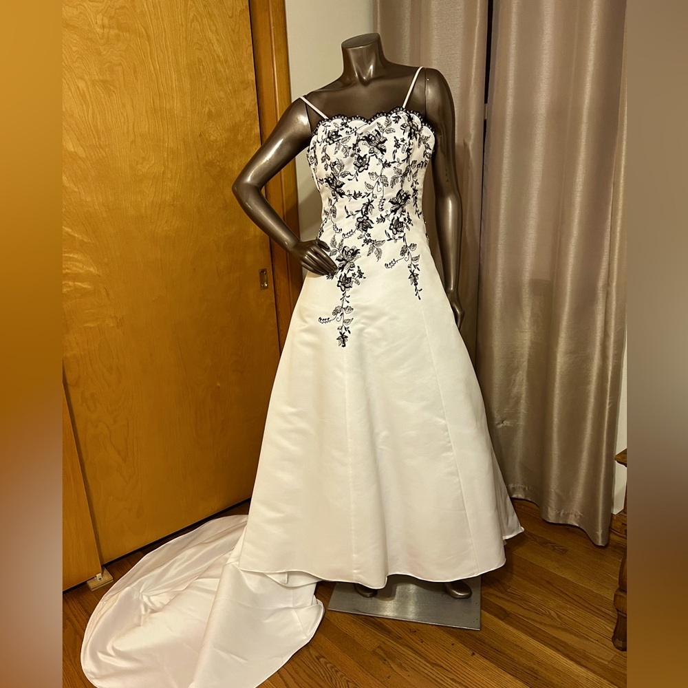 David’s Bridal style T8763R white with black embroidery.